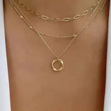 Classic Gold Layered Necklace with Pendant Design